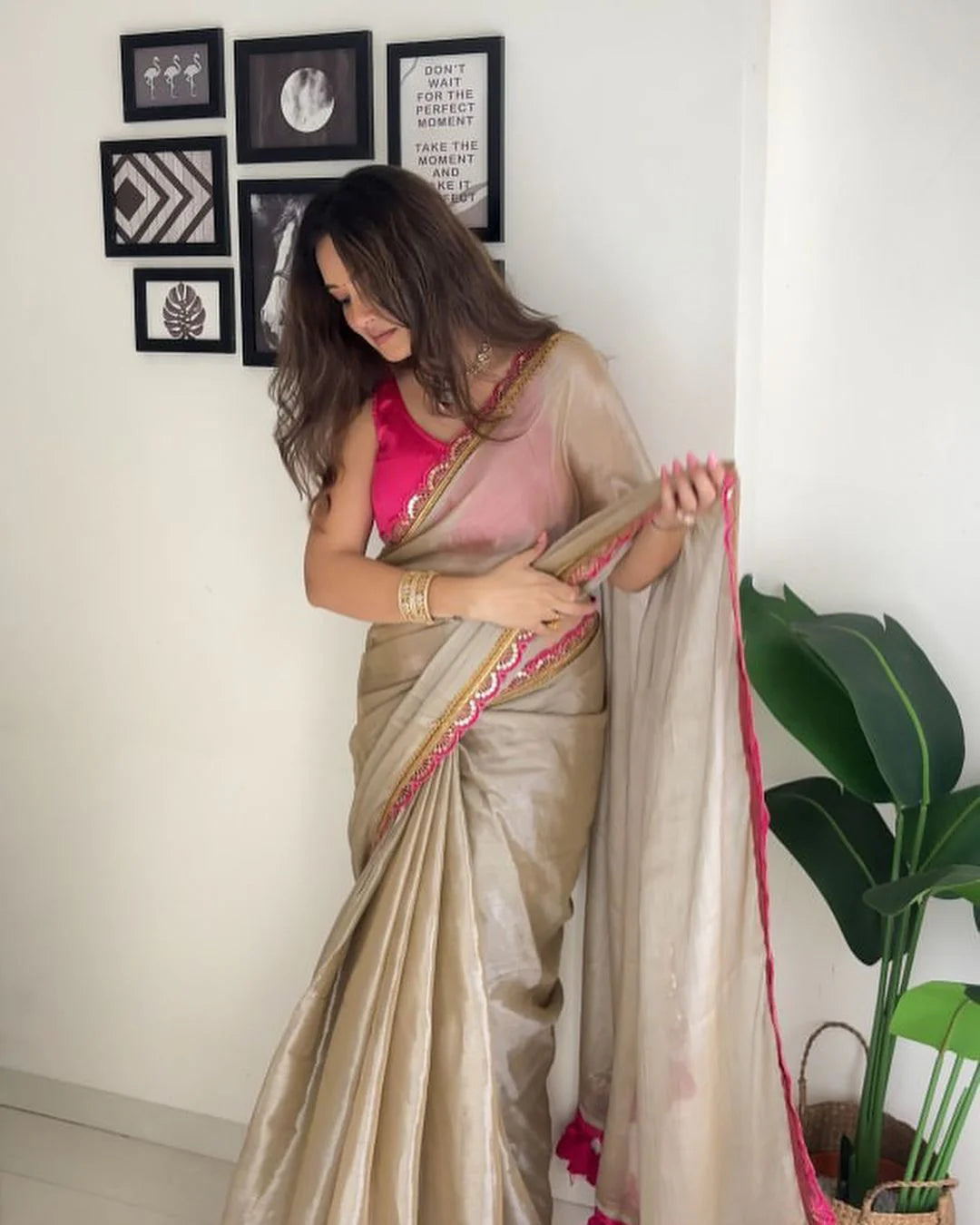 Classy Gold and Pink Saree with Glossy Finish and Tassel Accents