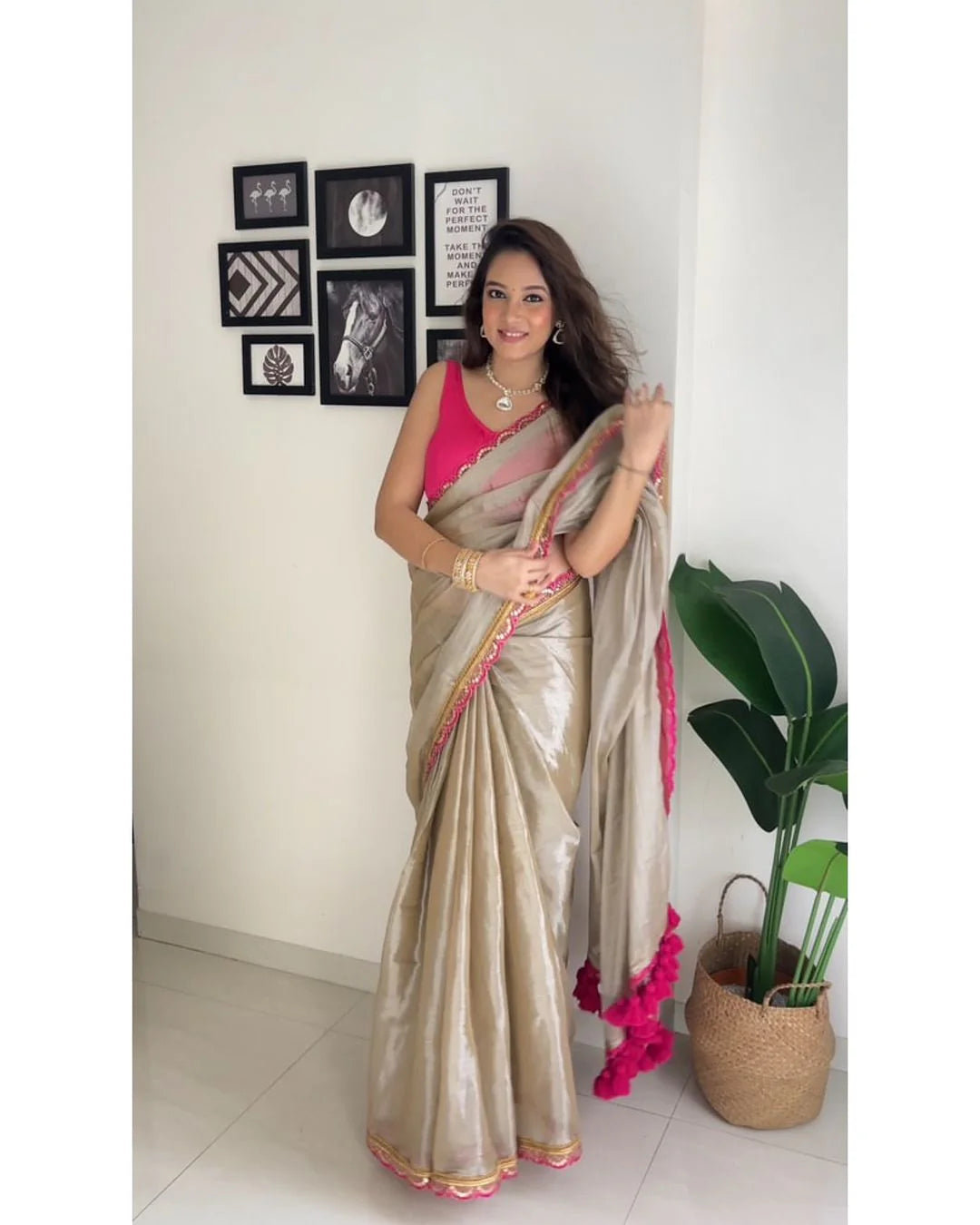 Classy Gold and Pink Saree with Glossy Finish and Tassel Accents