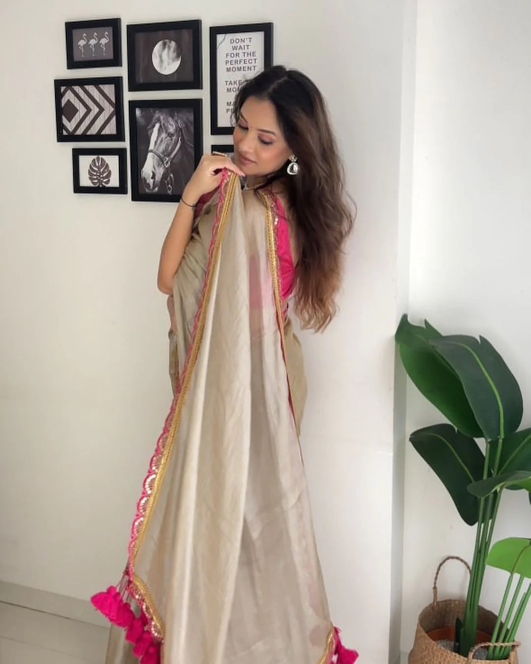 Classy Gold and Pink Saree with Glossy Finish and Tassel Accents