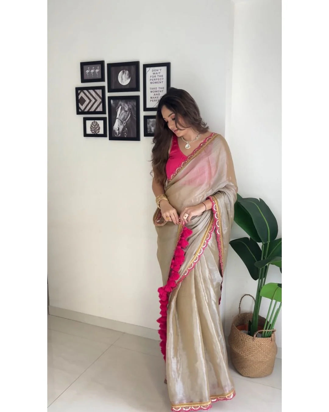 Classy Gold and Pink Saree with Glossy Finish and Tassel Accents