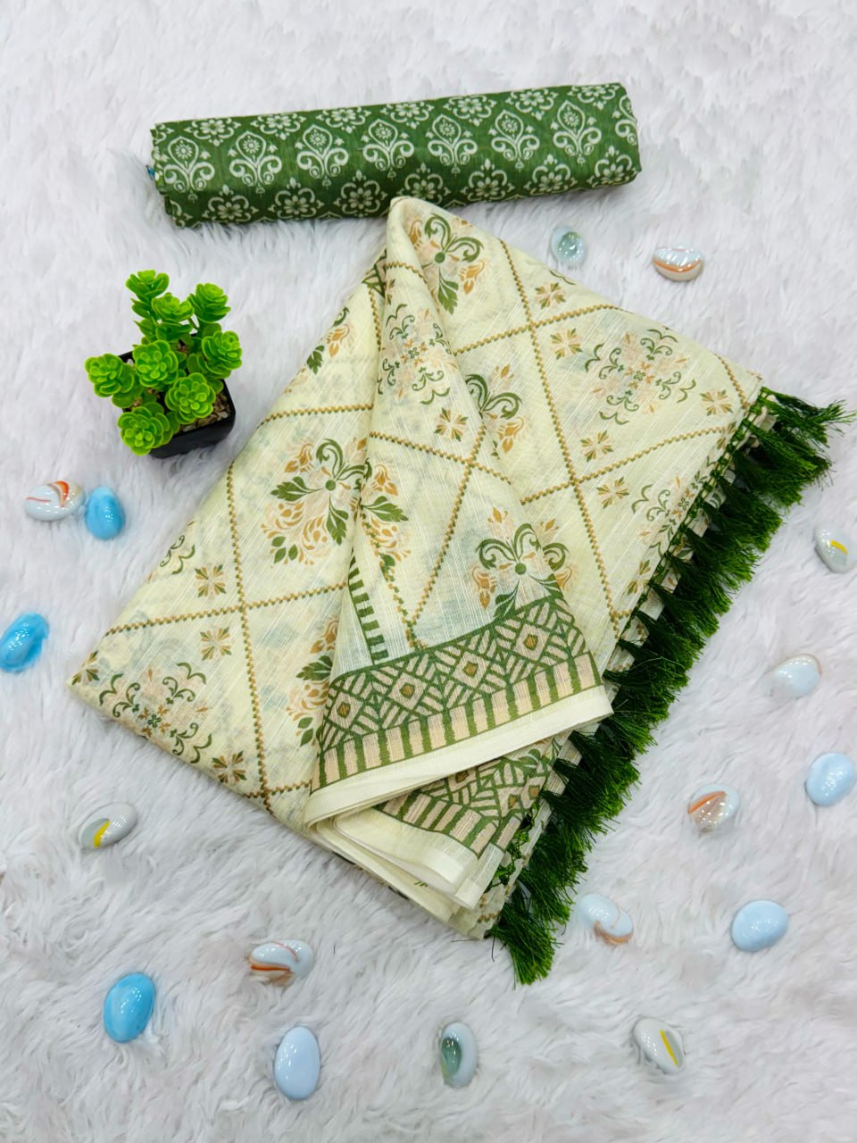 Elegant Cream and Green Cotton Saree with Floral Motifs