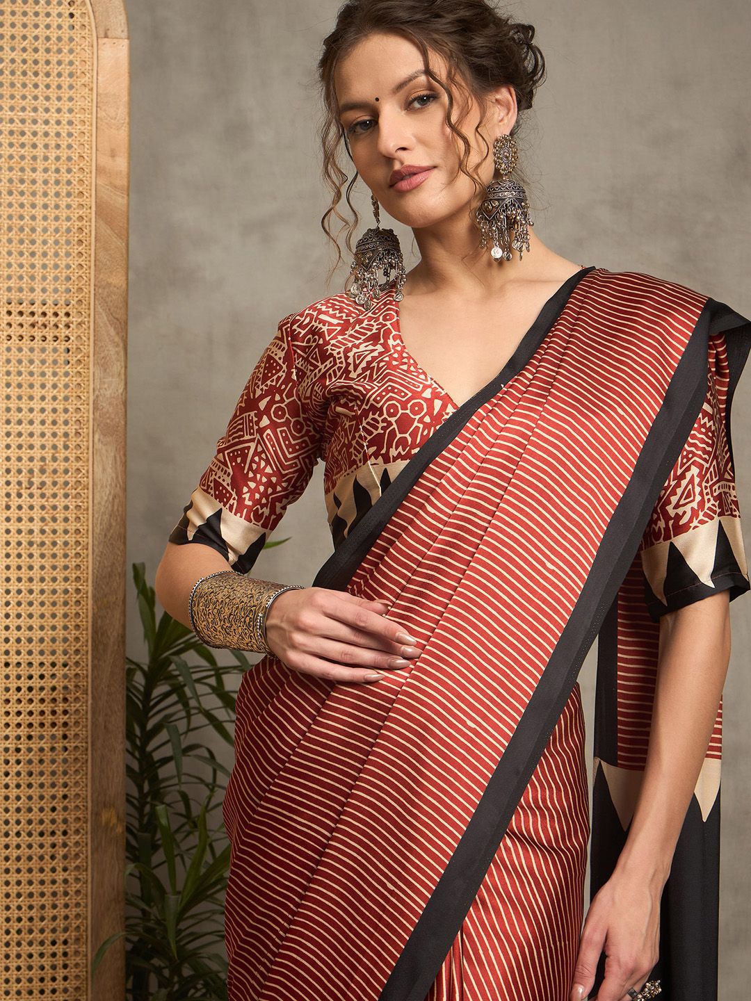 Contemporary Rust & Black Gajji Silk Saree with Tribal-Inspired Border & Printed Blouse