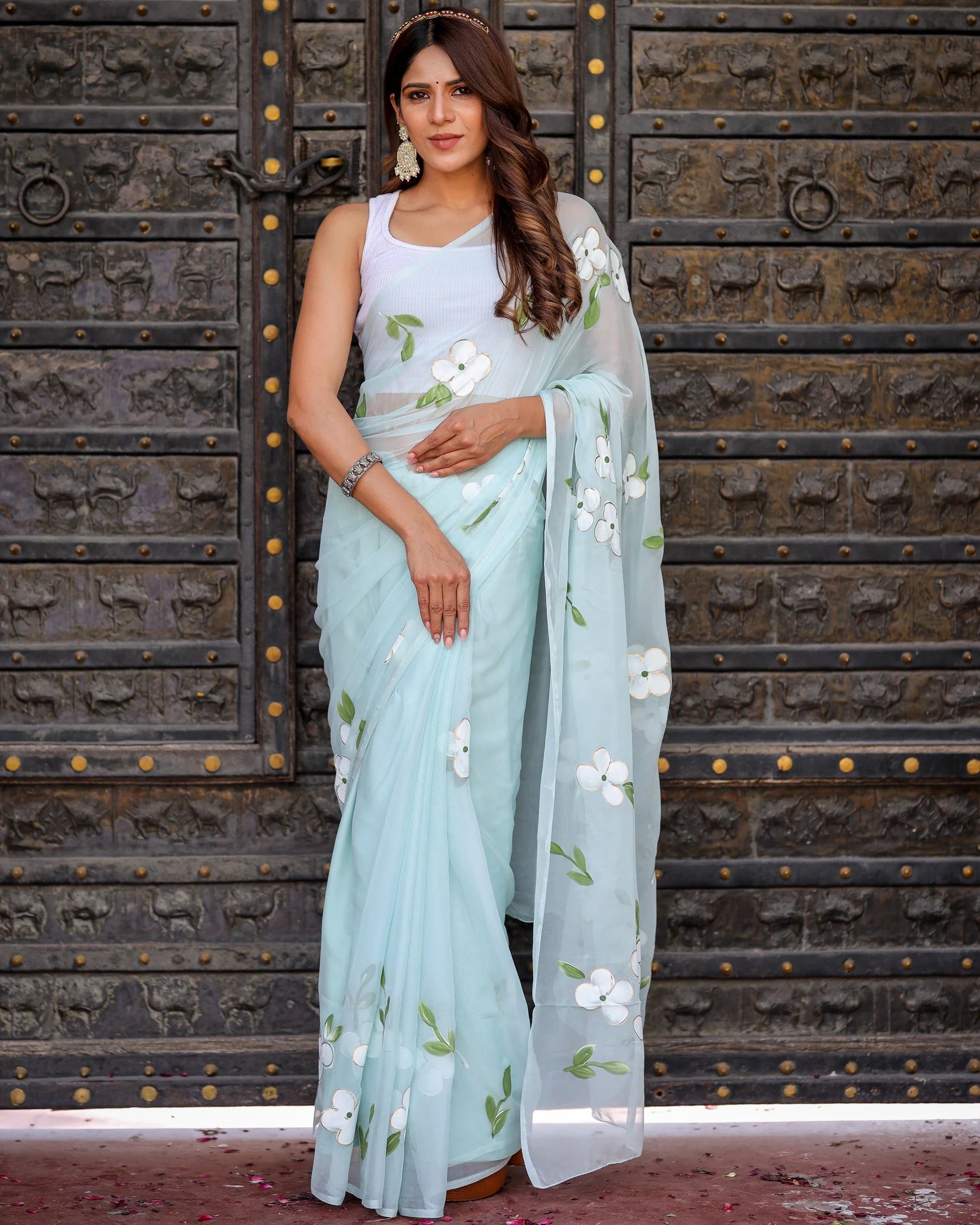 Pastel Blue Georgette Saree with Hand-Painted White Floral Motifs & Green Leaves – Attached Blouse – 5.5 Meters