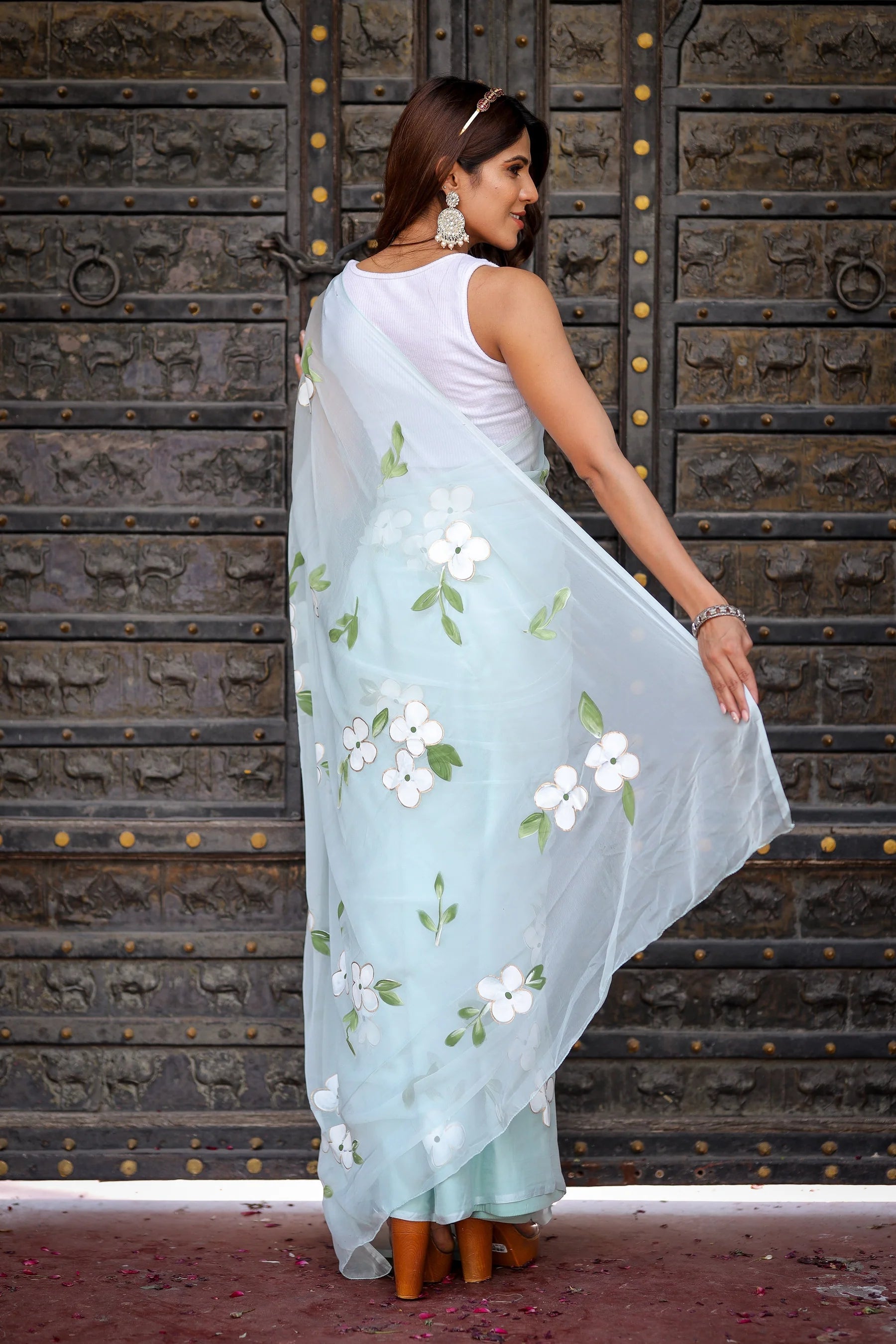 Pastel Blue Georgette Saree with Hand-Painted White Floral Motifs & Green Leaves – Attached Blouse – 5.5 Meters