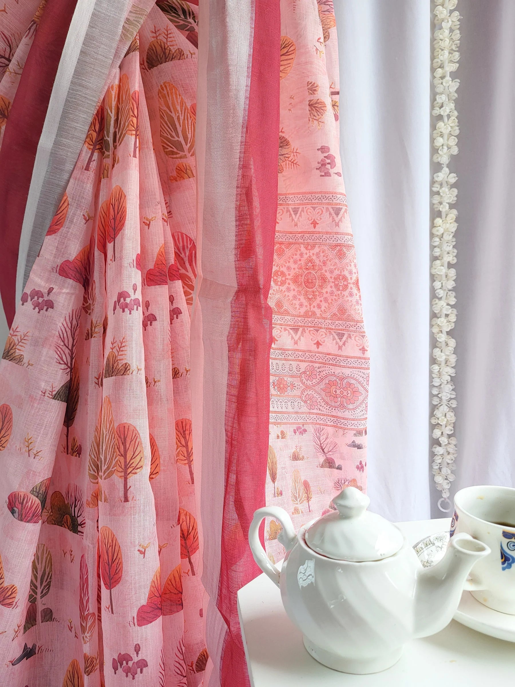 Blush Pink Handwoven Linen Saree with Vibrant Autumn Motifs & Tassel Detailing