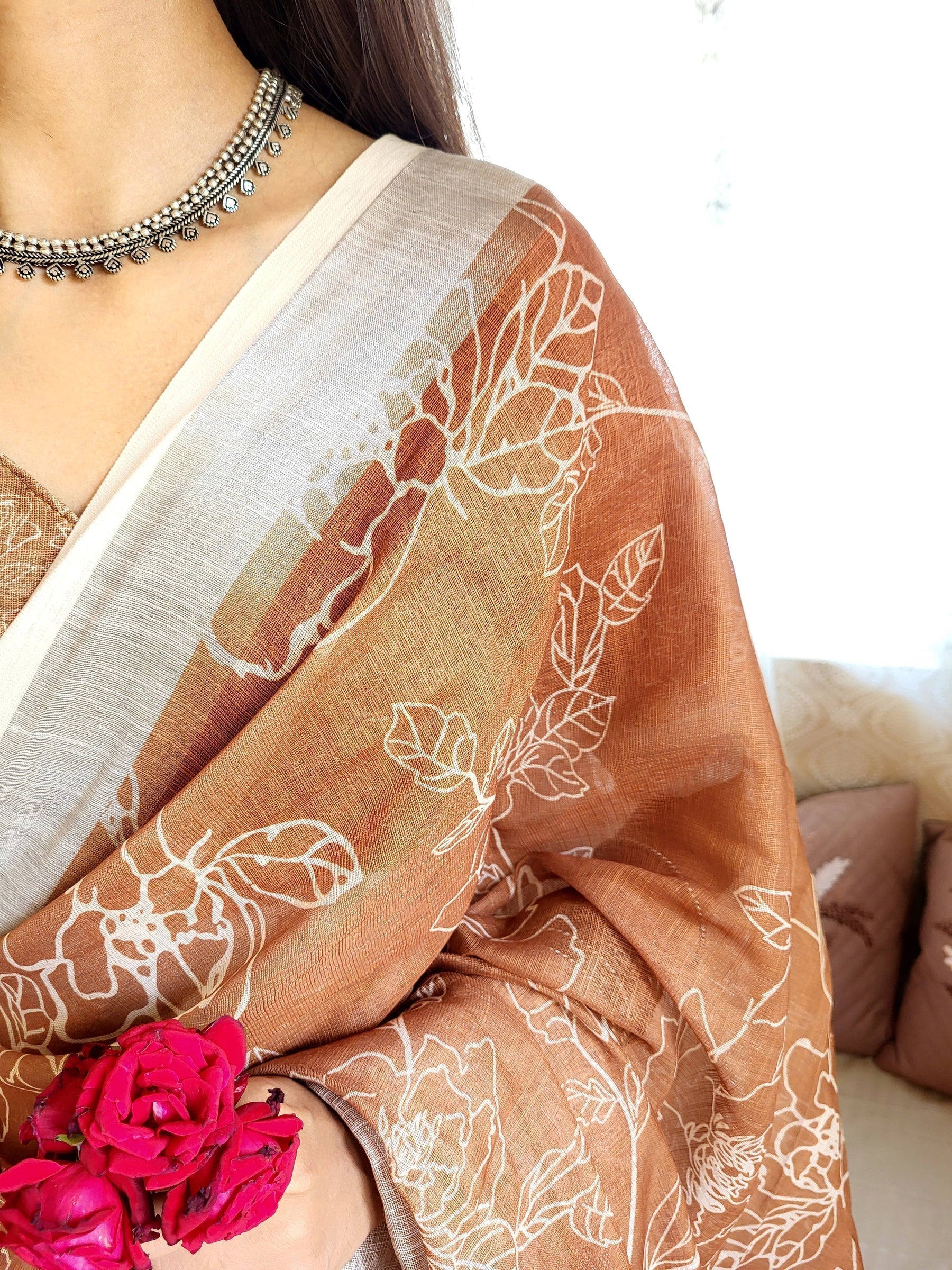 Rust Brown Pure Linen Saree with White Floral Motifs and Tassel Detailing