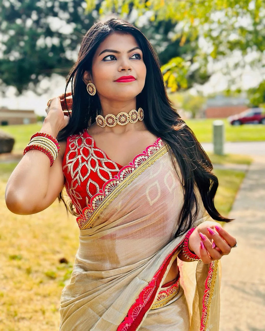 Classy Gold and Pink Saree with Glossy Finish and Tassel Accents