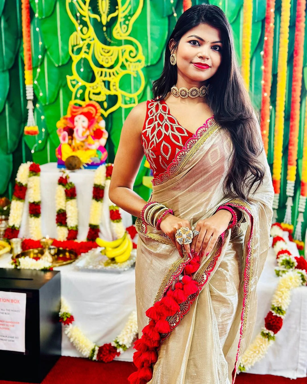 Classy Gold and Pink Saree with Glossy Finish and Tassel Accents