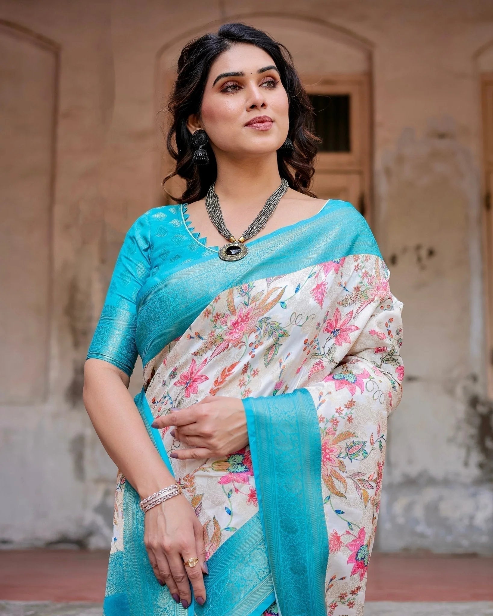 White and Aqua Floral Design Banarasi Silk Saree with Zari Weave and Tassel-Embellished Pallu