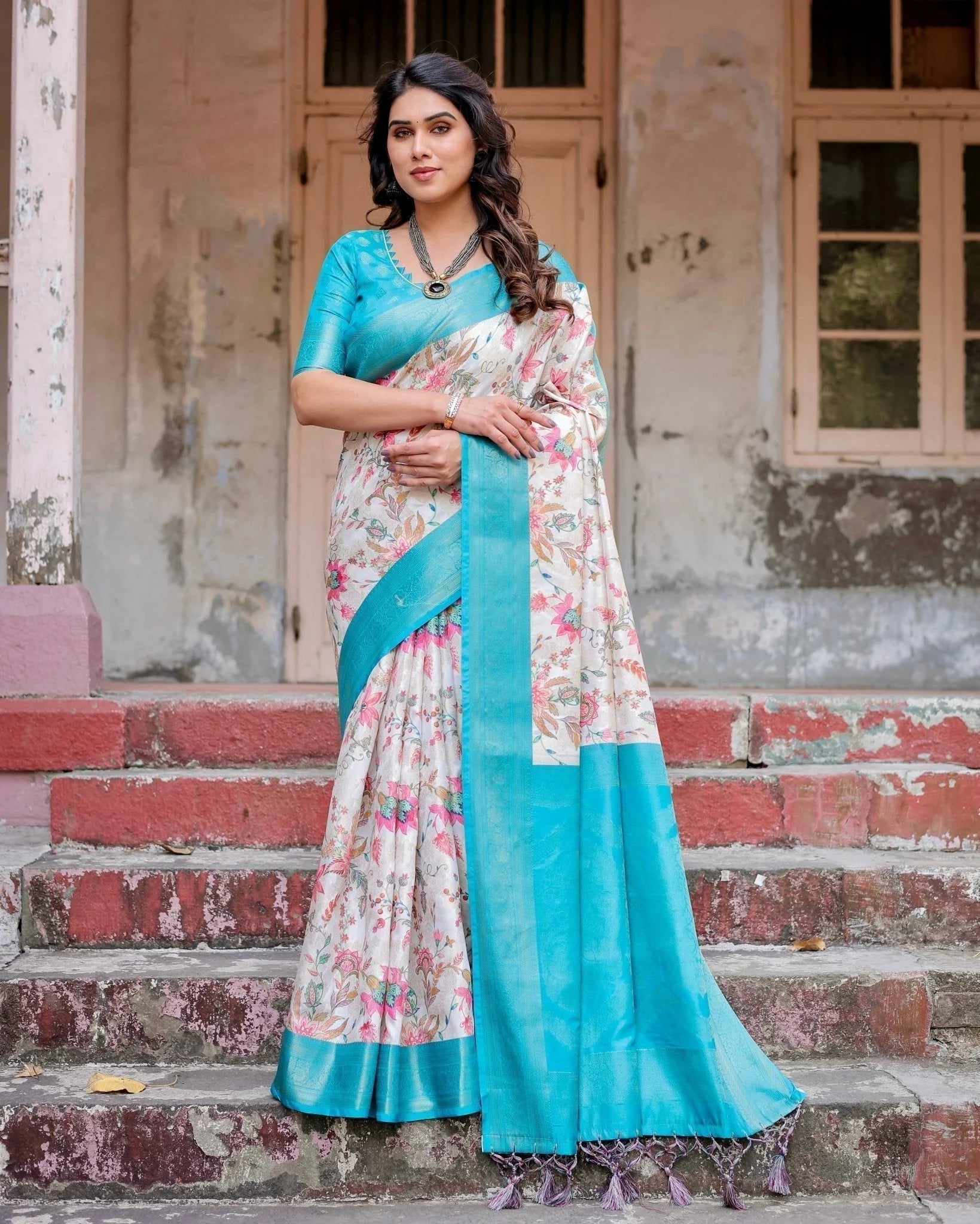 White and Aqua Floral Design Banarasi Silk Saree with Zari Weave and Tassel-Embellished Pallu