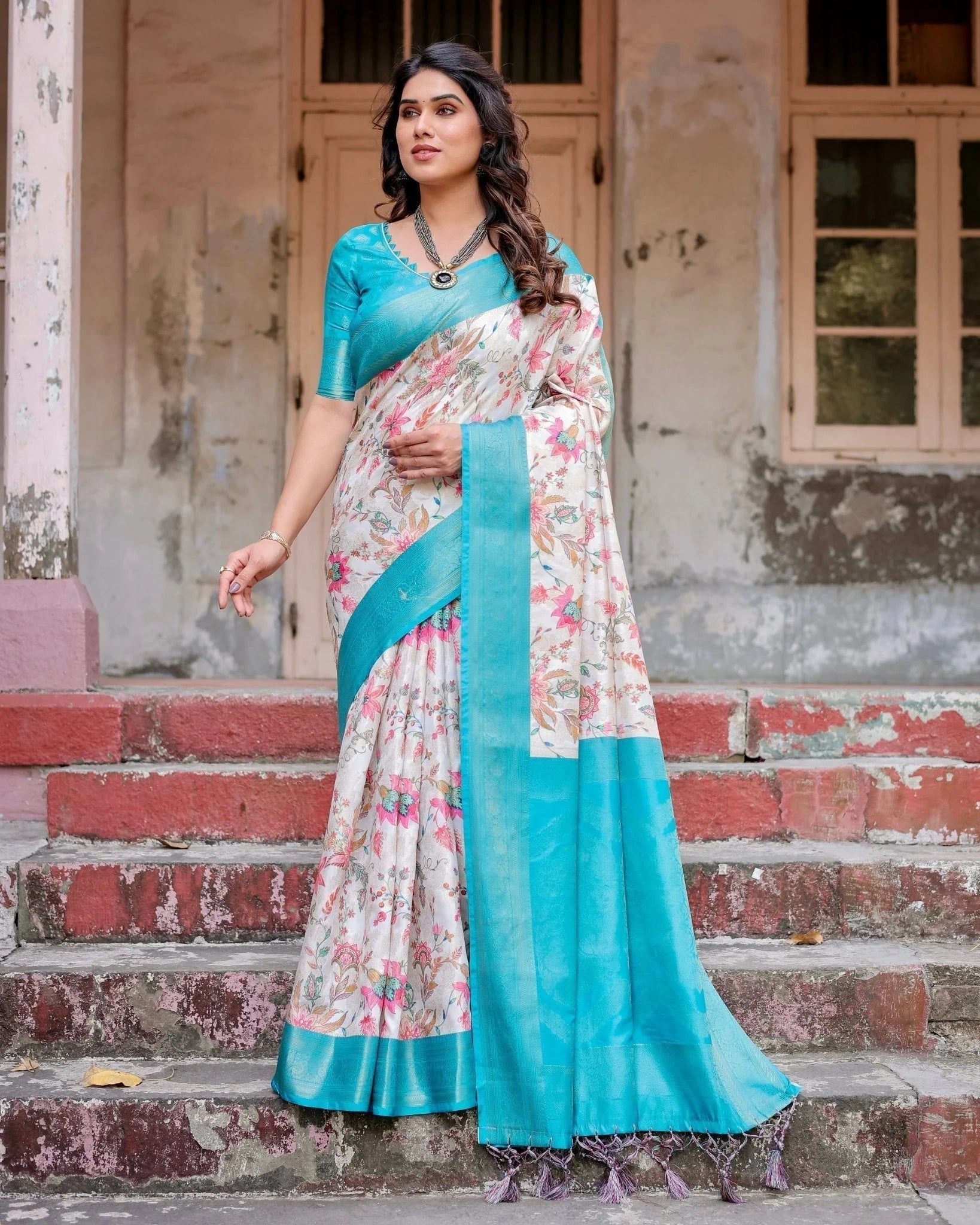 White and Aqua Floral Design Banarasi Silk Saree with Zari Weave and Tassel-Embellished Pallu