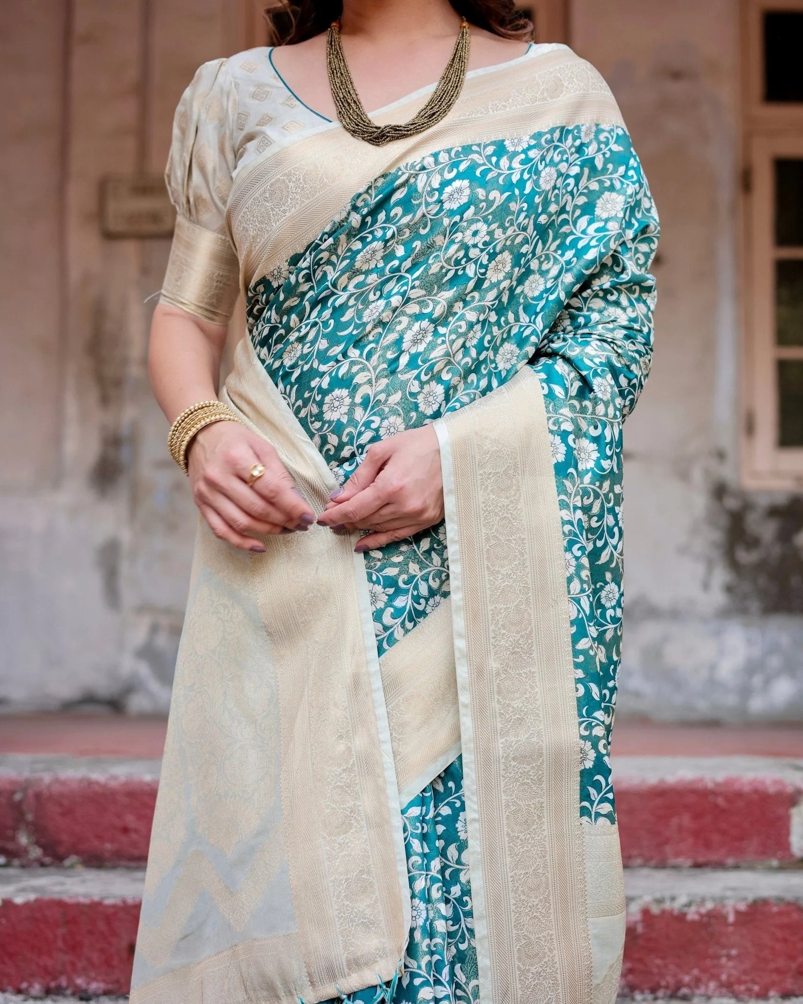 Teal and Cream Floral Banarasi Silk Saree with Zari Weave and Tassel-Accented Pallu